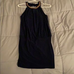 navy blue dress with gold lining by neck piece
